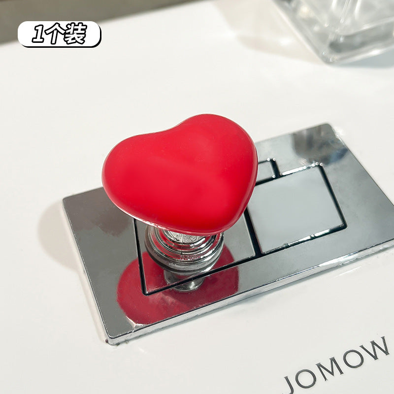 Sercowaty przycisk do spłukiwania toalety – uroczy wydłużacz